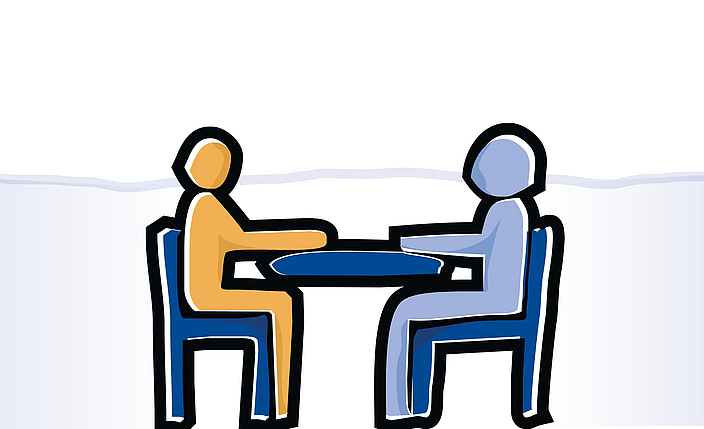 Grafik zweier Stichmännchen, die an einem Tisch sitzen.